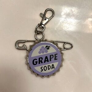 Grape soda keychain from UP. Pixar / Disney